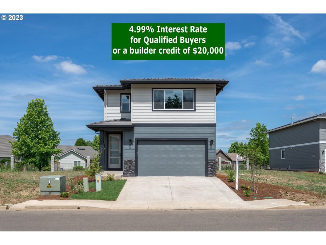 A modern two-story home with a gray facade, double garage, and a sign offering a 4.99% interest rate or $20,000 builder credit.