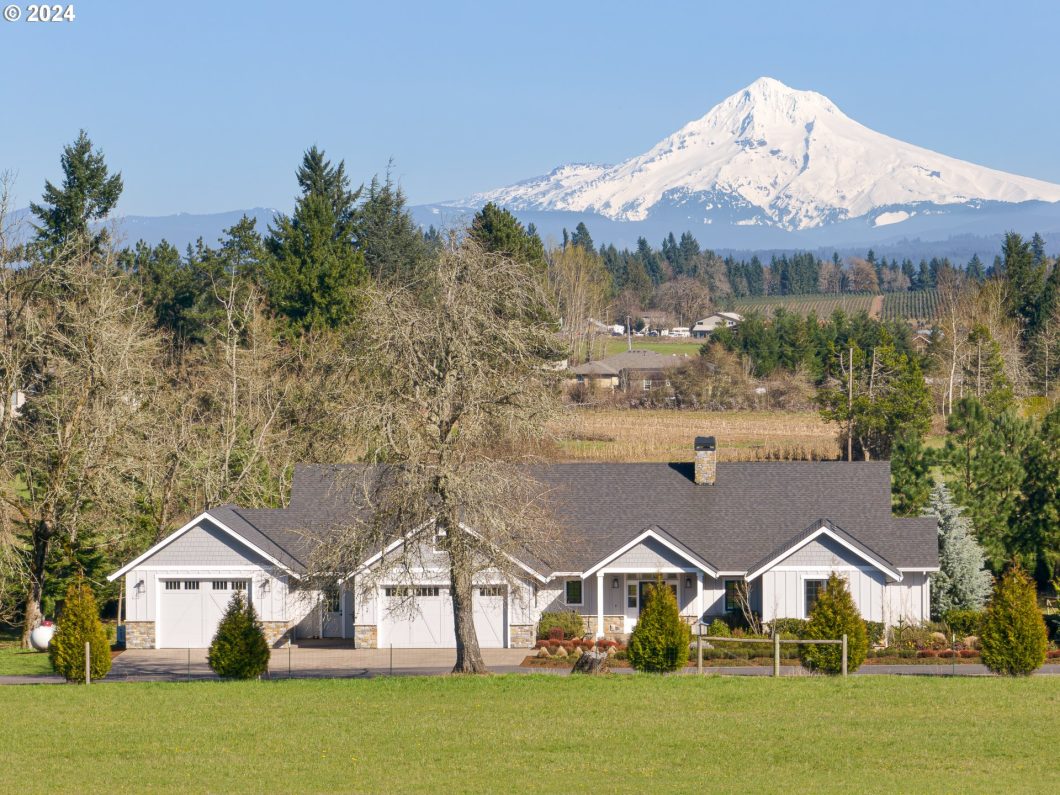 A single-story ranch-style home with a scenic view of Mount Hood in the background.