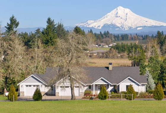 A single-story ranch-style home with a scenic view of Mount Hood in the background.